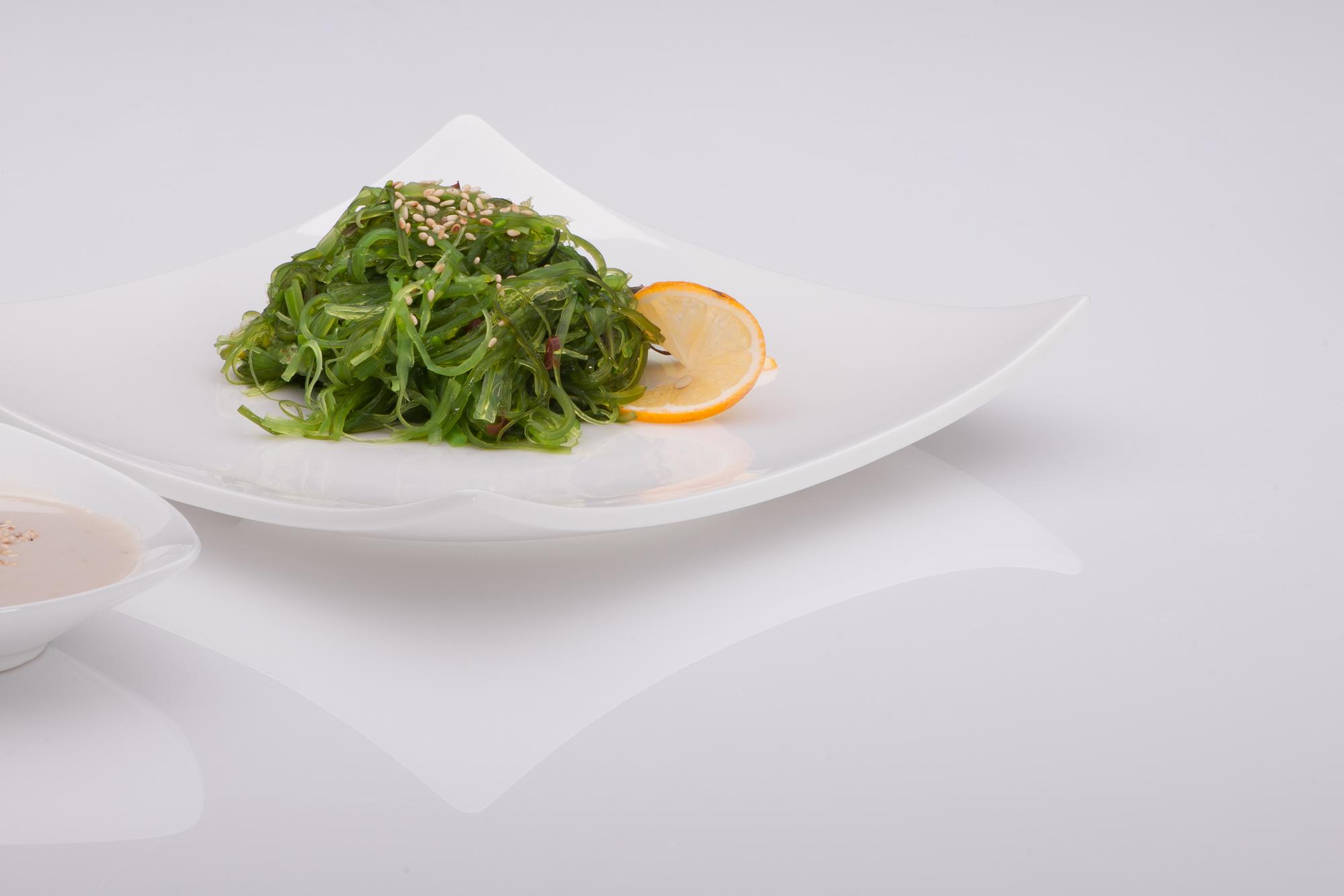 Plated course in white plate with greens